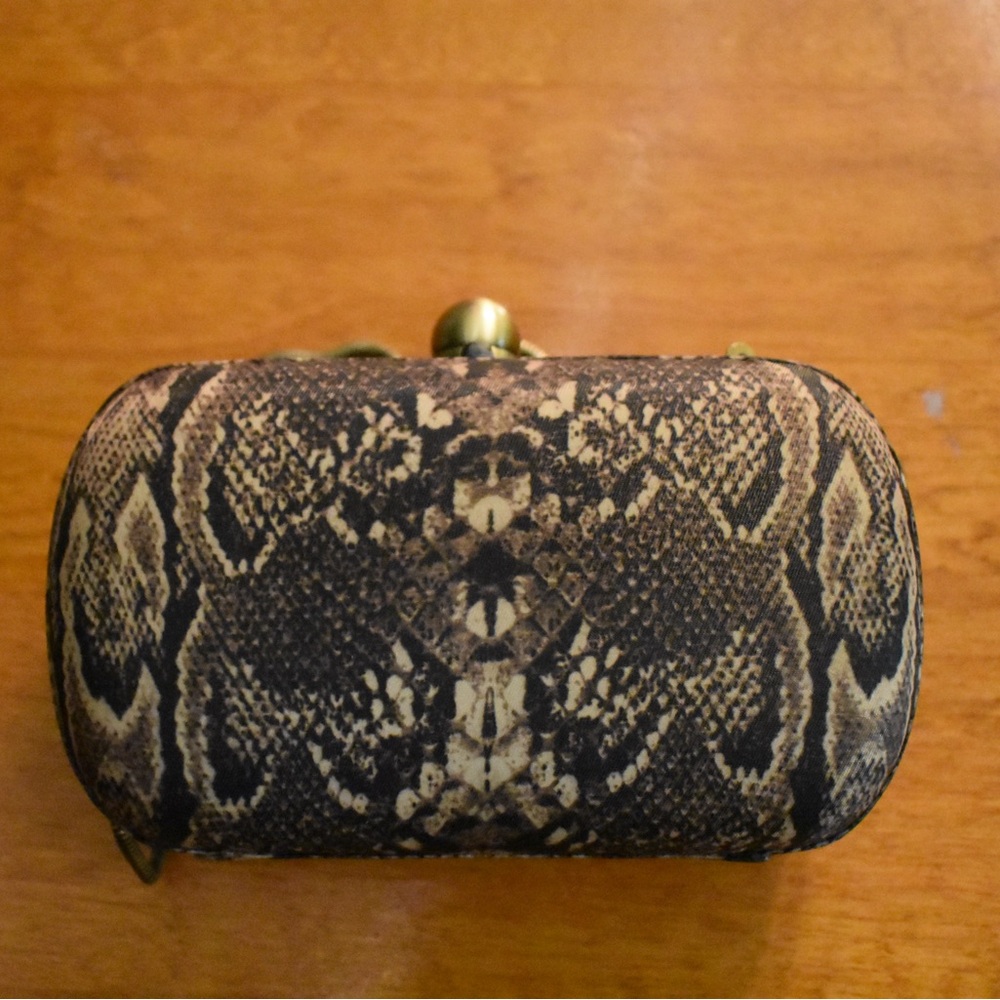 Lucky Brand snake print clutch snap top with metal strap